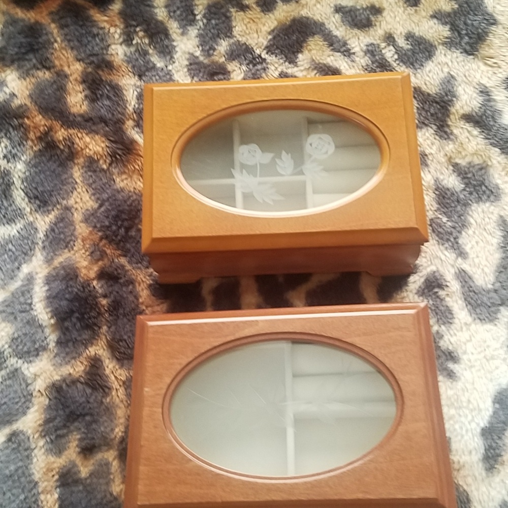 Two wooden jewelry boxes designed differently